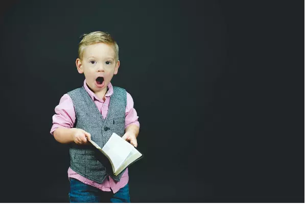 Boy with book | Agile Team Processes | Eduhubspot
